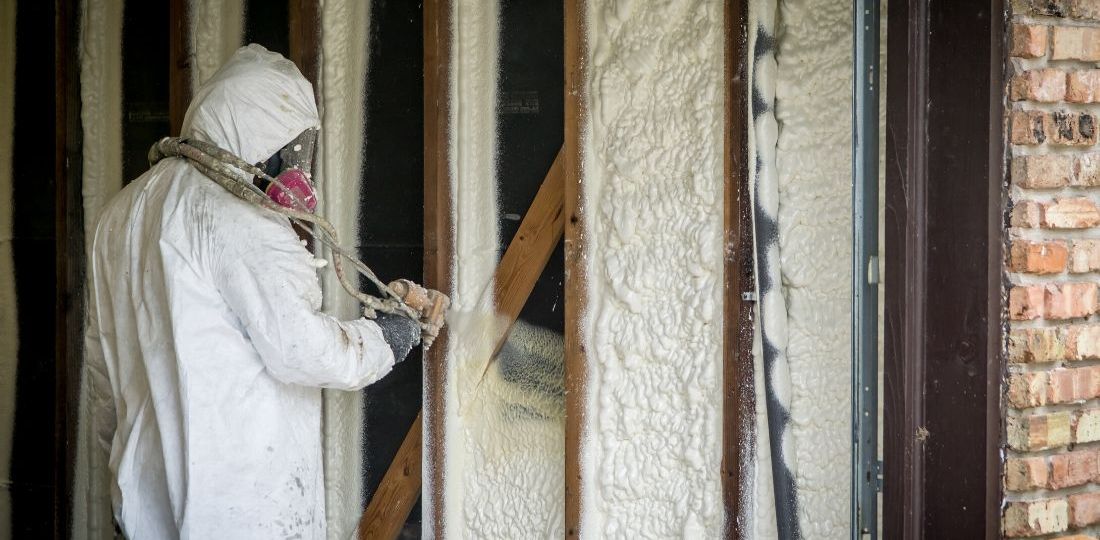 applying spray foam insulation