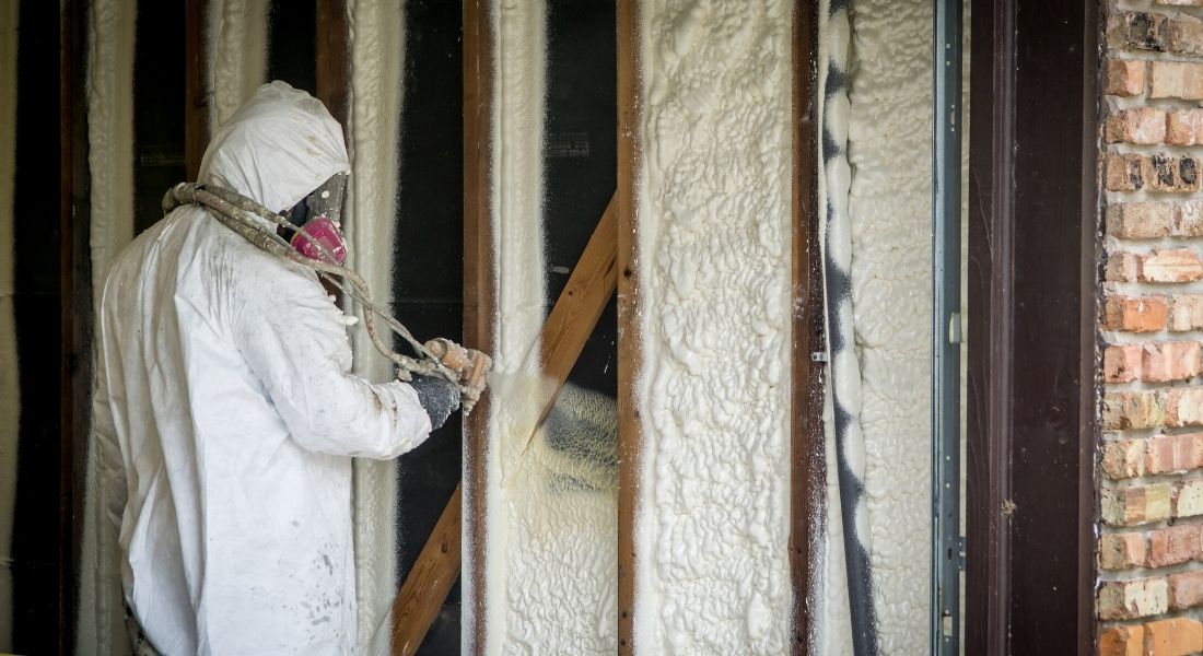 applying spray foam insulation